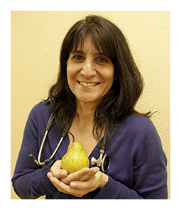 Dr. Kutob holding a pear